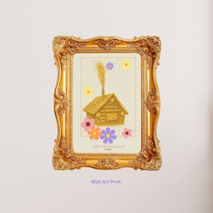 May include: A gold ornate frame containing a print of a glittery gold cabin with smoke rising, surrounded by colorful flowers in yellow, pink, orange, and purple. The text "Golden Cabin by MarinaArt PARIS" is printed at the bottom of the artwork.