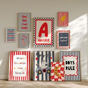 May include: A gallery wall set of ten framed posters featuring red, blue, and white colour schemes. Designs include a large letter A with the name ARCHIE, a bear in a race car, a leopard, a yellow lightning bolt, and text such as BOYS RULE.