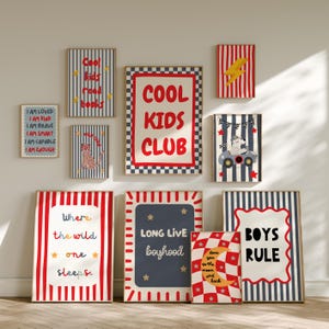 May include: A selection of framed art prints with diverse designs and text. The prints feature stripes, stars, and illustrations of a car and a leopard. Text includes "Cool Kids Club", "Boys Rule", and inspirational phrases.