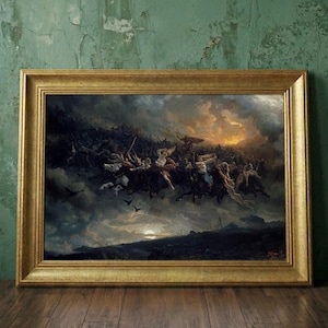 May include: A framed painting in a gold-coloured wooden frame. The artwork shows a dramatic scene with figures on horseback, set against a stormy sky with a sunset. The painting is displayed on a wooden floor against a green wall.