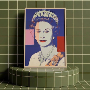 May include: A framed pop art print featuring a portrait of Queen Elizabeth II. The artwork uses bold colors, including blue, red, and pink, with a light-colored face and a crown. The print is displayed on a green tiled surface.