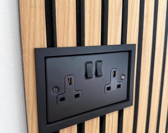 Light switch and plug socket surround for acoustic panelling