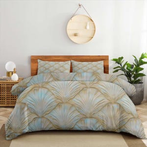 May include: A bedding set featuring a duvet cover and two matching pillowcases with a repeating fan-shaped shell pattern in soft shades of light blue, cream, and gold. The fabric displays a textured, layered design across the entire surface.
