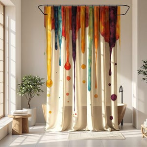 May include: A cream-colored shower curtain with a colorful watercolor design. Vertical streaks of yellow, orange, red, blue, and purple drip down the curtain, with matching circular accents. The curtain hangs in a bright bathroom setting.