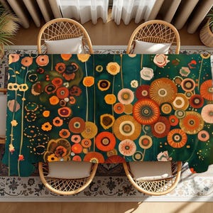 May include: A rectangular tablecloth featuring a dark teal background with a repeating pattern of stylized circular flowers in shades of orange, yellow, red, and cream. The floral design includes thin vertical stems and various circular shapes.