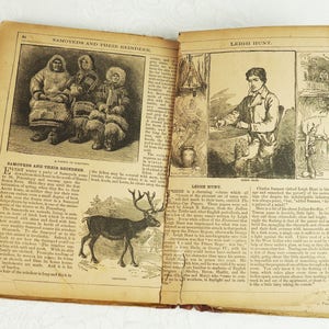 May include: An open book with two pages showing illustrations of people and animals. The left page shows a group of people wearing fur clothing and sitting in a snowy landscape. The right page shows a portrait of a man sitting in a chair and a reindeer standing in a snowy landscape. The text on the pages reads "Samoyeds and Their Reindeer" and "Leigh Hunt".
