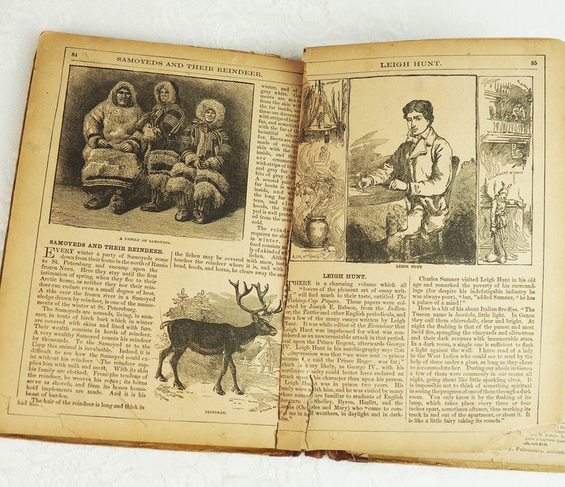 May include: An open book with two pages showing illustrations of people and animals. The left page shows a group of people wearing fur clothing and sitting in a snowy landscape. The right page shows a portrait of a man sitting in a chair and a reindeer standing in a snowy landscape. The text on the pages reads "Samoyeds and Their Reindeer" and "Leigh Hunt".