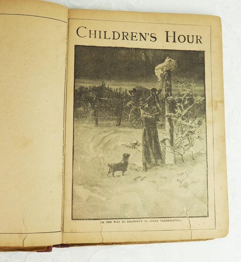 May include: A black and white illustration of a family traveling by horse-drawn carriage in a snowy landscape. The image is from a vintage children's book called "Children's Hour". The caption reads "On the way to Grandpa's to spend Thanksgiving."