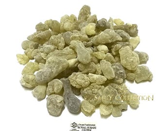May include: A pile of light green, irregularly shaped frankincense resin pieces. The image includes the text "SABILY COLLECTION" and "Omani Frankincense ROYAL HOJARI GREEN". The resin pieces have a rough, textured appearance.