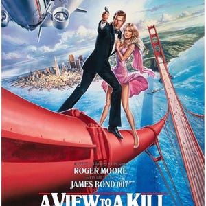 May include: Movie poster for "A View to a Kill" featuring Roger Moore as James Bond. The poster shows Bond holding a gun, with a woman in a pink dress. The Golden Gate Bridge and a plane are in the background. Text includes "HAS JAMES BOND FINALLY MET HIS MATCH?"