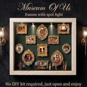May include: A display case featuring several gold-framed photographs, arranged on a dark green backdrop. The text reads "Museum Of Us" and "frames with spot light". Miniature figures are positioned at the bottom. The text "No DIY kit required, just open and enjoy" is at the bottom.