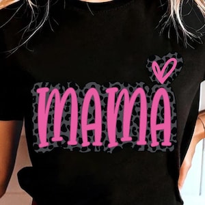 May include: Black t-shirt with the word "MAMA" in pink letters with a gray leopard print background. A pink heart is above the word "MAMA".