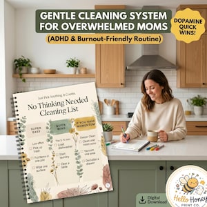 May include: A set of three ceramic mugs with a speckled, matte finish. The mugs are in shades of cream, gray, and black. Each mug has a rounded handle and a simple, modern design. The mugs are likely for coffee or tea.