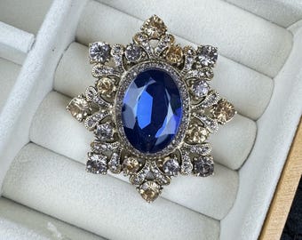 Broche vintage de cristal de zafiro, broche llamativo con halo multicolor en tono dorado.