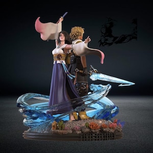 Op de afbeelding: Gedetailleerd beeldje van twee personages uit Final Fantasy X. Het vrouwelijke personage draagt een witte en paarse jurk, terwijl het mannelijke personage blond haar en een zwarte outfit heeft. De basis heeft watereffecten en koraal.