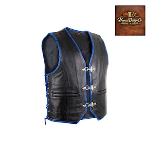 May include: Black leather vest with blue stitching and trim. It has silver-tone clasps and side lacing. The vest features a V-neck design and two front pockets. The Hamza Design Co. logo is in the upper right corner.