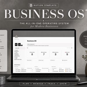 May include: A laptop displaying a Notion template called "Business OS" with the text "The All-In-One Operating System for Modern Businesses." The screen shows a dashboard with data and icons. A pen, a plant, and a cylindrical object are on the desk.