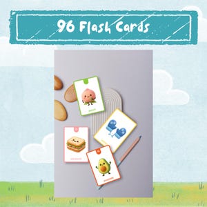 Puede incluir: Un juego de 96 tarjetas didácticas con ilustraciones coloridas. Las tarjetas presentan imágenes de un melocotón, sándwich, mitones y aguacate. Las palabras "melocotón", "sándwich", "mitones" y "aguacate" están escritas en las tarjetas. Las tarjetas están dispuestas sobre una superficie gris.