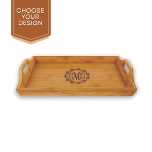 May include: A rectangular bamboo serving tray with two handles. The tray has a monogrammed design with the letters "EM" in a wreath.
