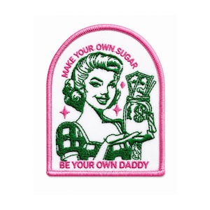 May include: An embroidered patch with a white background and a pink border. It features a green illustration of a person holding a jar of money, with the pink text "MAKE YOUR OWN SUGAR" above and "BE YOUR OWN DADDY" below the illustration.