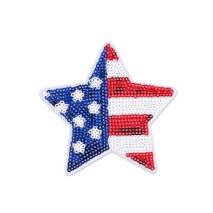 May include: A star-shaped decorative item featuring the American flag design. The left side has a blue background with white stars, and the right side has red and white stripes. The item is made of small, round, reflective beads.
