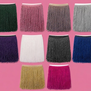 May include: A collection of ten skirts featuring long, shimmering fringe detailing and elastic waistbands. The skirts are presented in a variety of colours including dark green, pink, bronze, silver, purple, white, black, blue, gold, and magenta.