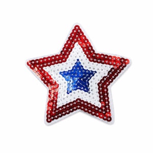 May include: A sequined star patch in red, white, and blue. The outer star is red, the middle is white, and the inner star is blue. The patch is likely for decorative purposes, such as on clothing or accessories.