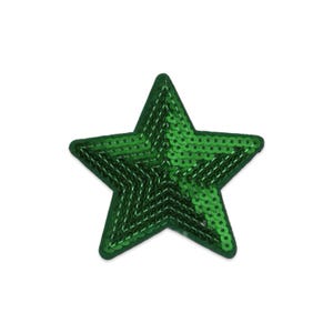 May include: A five-pointed star-shaped patch covered in small, shiny, emerald green sequins. The edges of the star are defined by a dark green border, and the surface is densely packed with reflective circular sequins that create a textured appearance.