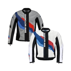 May include: Two motorcycle jackets, one gray and one white, with black and blue accents. The jackets have the BMW Motorrad logo printed vertically down the front. The gray jacket has a blue, red, and white stripe design.