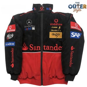 May include: Black and red racing jacket with multiple sponsor logos, including Vodafone, Mercedes-Benz, and Santander. The jacket has a zip-up front and features the text "San tande" across the chest.
