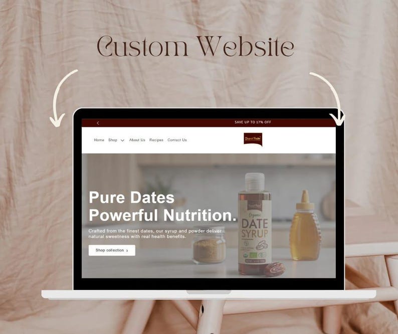 May include: A laptop displaying a website with the text "Custom Website." The website features the words "Pure Dates Powerful Nutrition" and images of date syrup and other products. The website also includes the text "Shop collection."