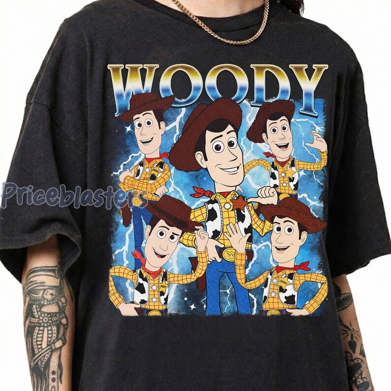 May include: Dark gray t-shirt featuring a graphic of Woody from Toy Story. The design includes multiple Woody illustrations with a blue and white lightning background and the word "WOODY" at the top.