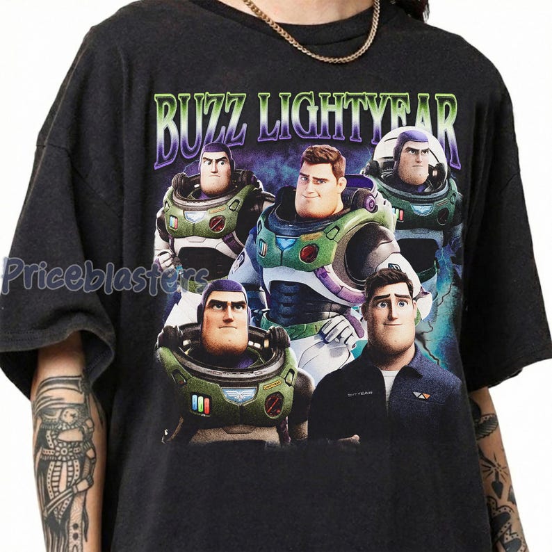 May include: Dark gray t-shirt featuring a graphic of Buzz Lightyear from Toy Story. The design includes multiple images of Buzz in his spacesuit, with the text "BUZZ LIGHTYEAR" in a green and purple font.