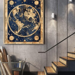 May include: A framed vintage map print featuring a detailed world map in shades of blue and gold. The map is surrounded by celestial elements like stars and moons. The artwork is displayed on a gray wall near a staircase.