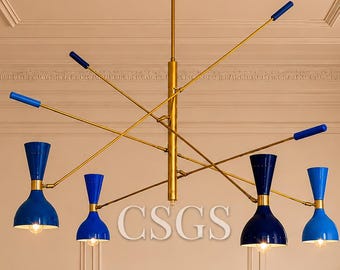 A modern mid-century style chandelier / ceiling pendant light with a colorful artistic design.