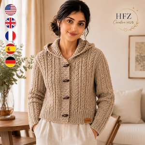 May include: A beige hooded cardigan featuring a textured knit pattern, long sleeves, and four dark brown toggle buttons down the front. The garment includes a small rectangular brown label at the bottom hem and a hood integrated into the collar.
