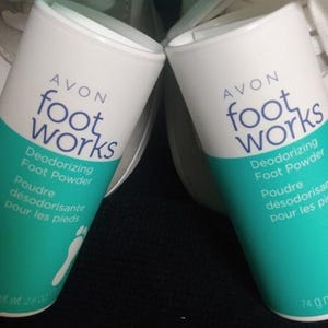 May include: Two white and teal Avon Foot Works Deodorizing Foot Powder containers. Each cylindrical container has the brand name and product information printed on it. The net weight is 74 g.