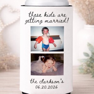 May include: White can cooler featuring two childhood photos and text. The top photo shows a child in red armbands and goggles. The bottom photo shows a child in a dress. Text reads "These kids are getting married!" and "the clarkson's 06.20.2026".