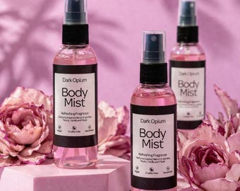 Bruma corporal Dark Opium, spray con fragancia cálida de vainilla y especias, de larga duración.