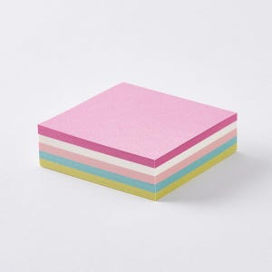 May include: A square stack of adhesive paper notes featuring a multi-colored design. The top sheet is light pink, followed by layers of white, light pink, light blue, and a bottom layer of light yellow, all arranged in a neat, flat, square block.