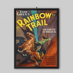 May include: A framed vintage movie poster for "The Rainbow Trail" by Zane Grey. The poster features a dynamic illustration of a person on horseback, with the title in large yellow letters. The poster includes the names of the actors and the Fox Picture logo.