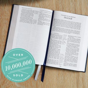 May include: Open Bible with blue cover, displaying text from Isaiah and Song of Solomon. A teal circle with the text "OVER 10,000,000 SOLD ECPA DIAMOND AWARD" is in the lower left corner.