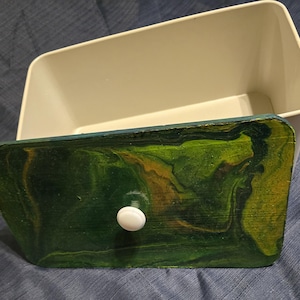 May include: A rustic wooden sign with the text "Welcome to our home" in white lettering. The sign features a distressed finish and a simple, inviting design, perfect for a front porch or entryway.