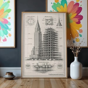 May include: A framed architectural print featuring a detailed black and white technical drawing of the Chrysler Building. The illustration includes structural diagrams, floor plans, bracing details, and foundation sections with the text TheEngineerStudioCo.
