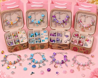 May include: Four square cork jewelry boxes with floral and owl patterns, each containing a charm bracelet and assorted beads. The bracelets feature colorful glass and metal charms, including stars, hearts, and animals, matching the loose beads stored in the divided compartments.