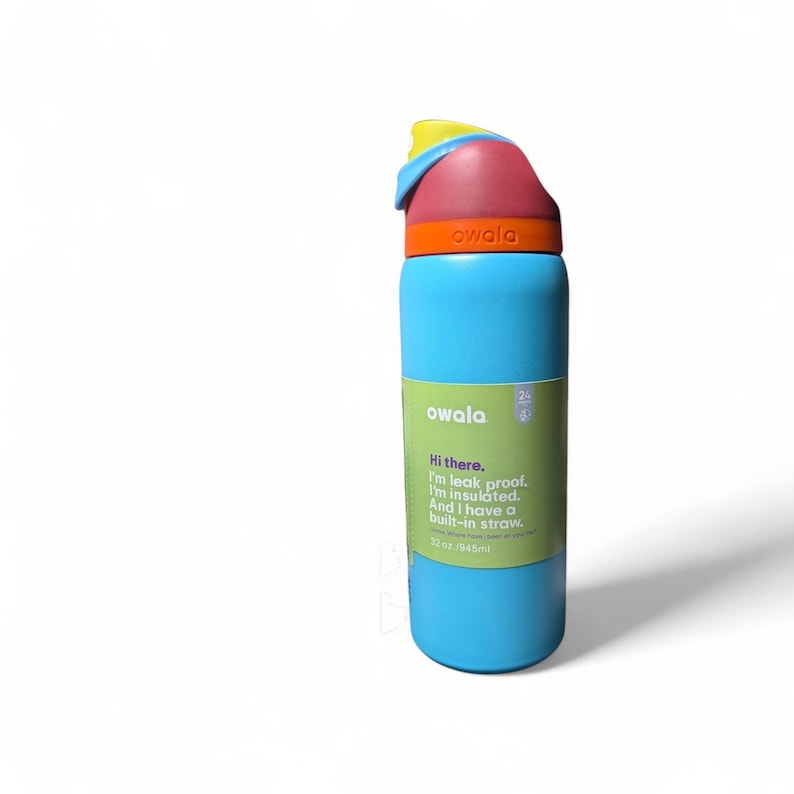 May include: A light blue insulated water bottle with a multi-colored lid featuring yellow, red, and orange accents. A green label on the front displays the text: Hi there. I'm leak proof. I'm insulated. And I have a built-in straw. 32 oz / 945ml.