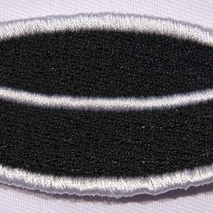 Hockey Puck Iron On Patch | 2.5x1.5 Inch Embroidered Ice Hockey Badge | Small Sports Patch for Jackets, Bags, Hats & DIY Hockey Gear