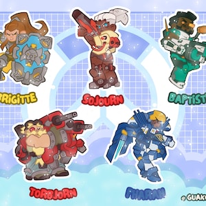 May include: A set of five character stickers featuring Brigitte with a shield, Sojourn with a railgun, Baptiste with a rifle, Torbjorn with a turret, and Pharah in blue armor. Each character is labeled with their name in colorful text.