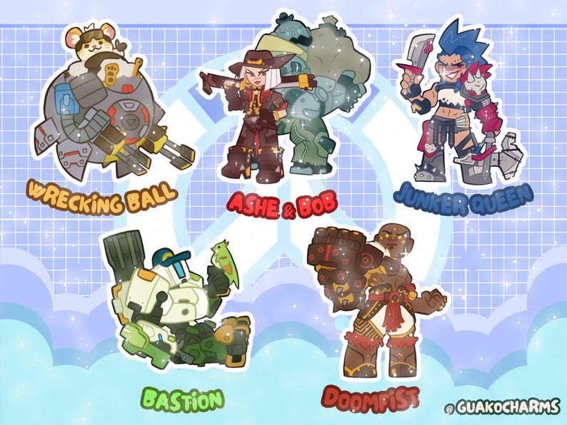 May include: A set of five character stickers featuring Wrecking Ball, Ashe and Bob, Junker Queen, Bastion, and Doomfist. Each character is illustrated in a chibi style with vibrant colors and outlines. The text labels for each character are included below them, and the brand name Guakocharms is printed in the bottom right corner.