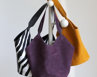 Handgjord lädershopper, elegant axelväska, hinkväska i äkta läder, minimalistisk, avslappnad hoboväska, boho chic, vardagsväska